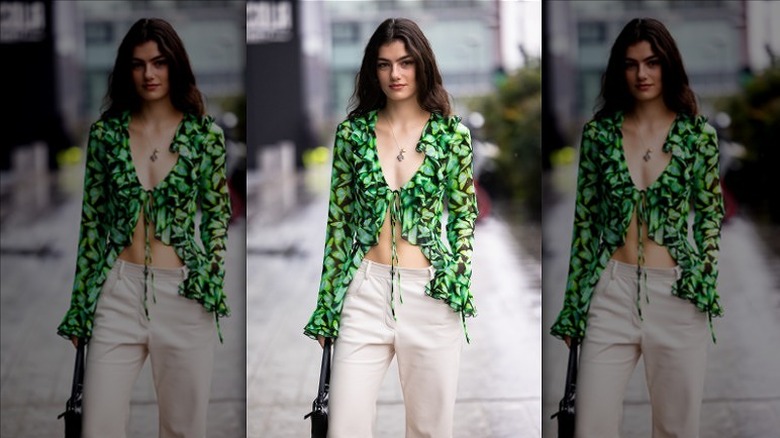 woman wearing green butterfly blouse