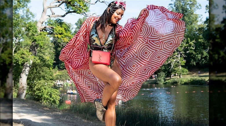 Woman poses in sheer caftan 