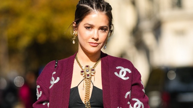 woman with large gold necklace