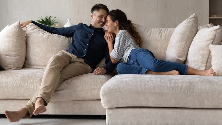 happy couple on couch