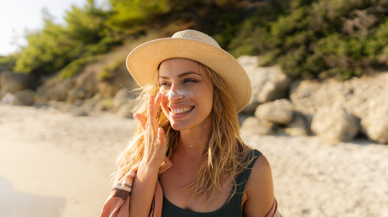 Woman with cream on nose