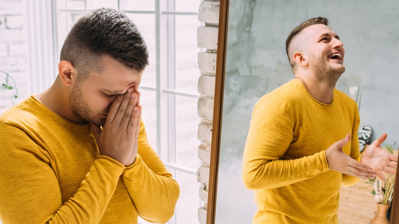 Stressed man with laughing reflection