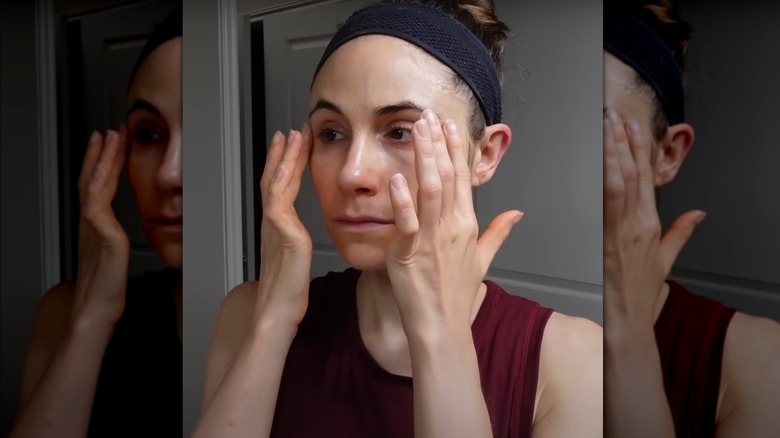 Dermatologist applying eye cream