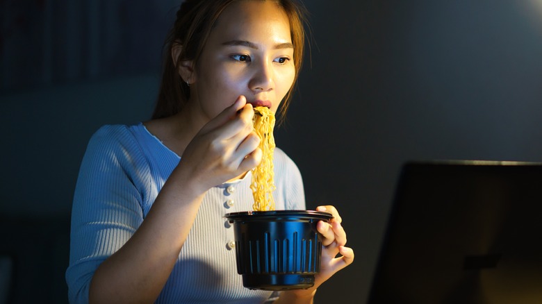 woman eating noodle