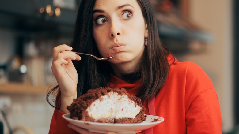 woman eating pie