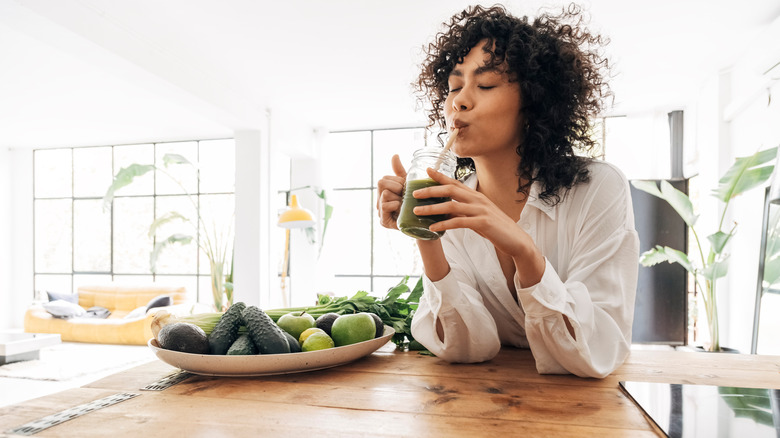 Woman drinking at her counter