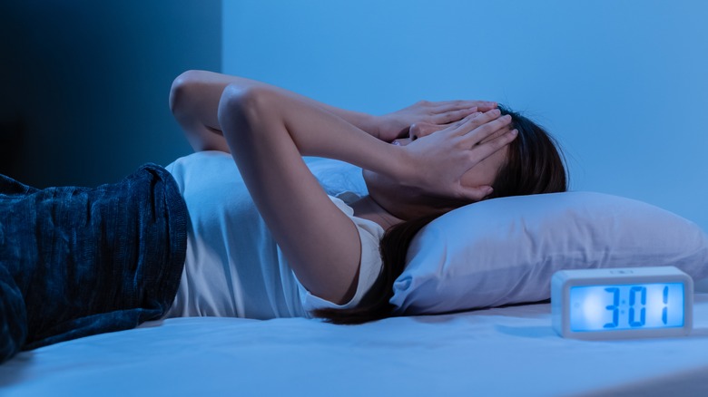 A woman stressed in bed