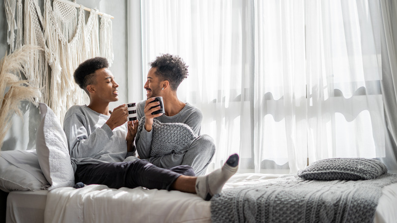 Couple having coffee in bed