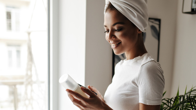 Woman looking at product ingredients