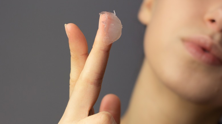 woman with Vaseline on finger