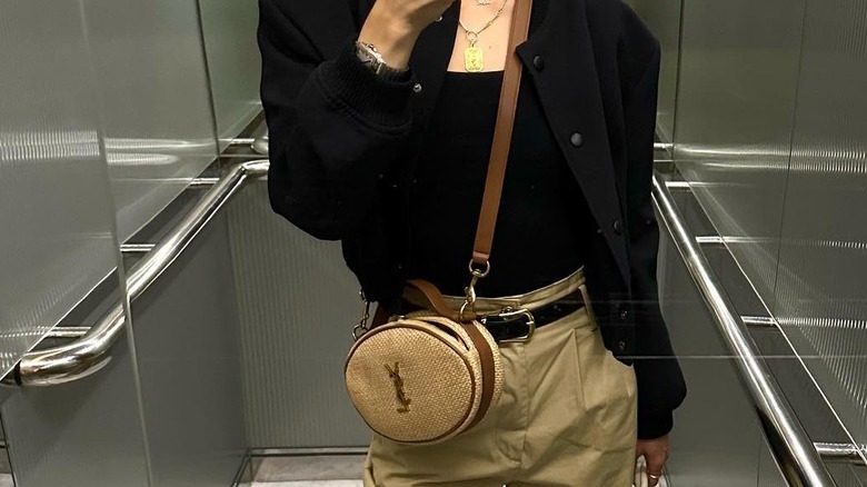 Girl wearing a circle raffia bag