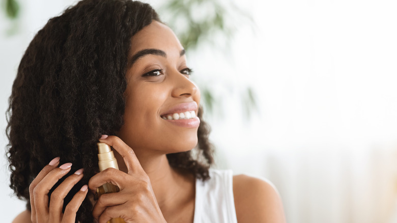 woman treating hair ends 