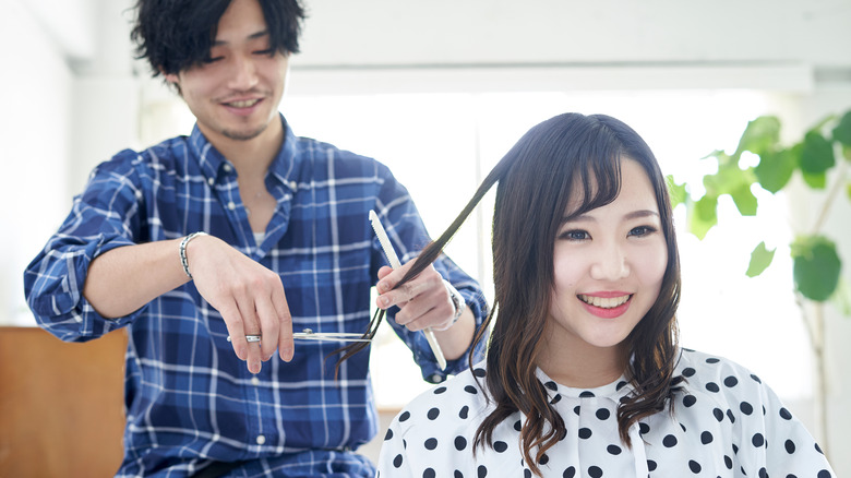 woman having hair cut 