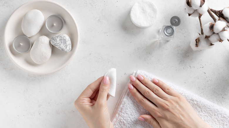 Woman removing nail polish