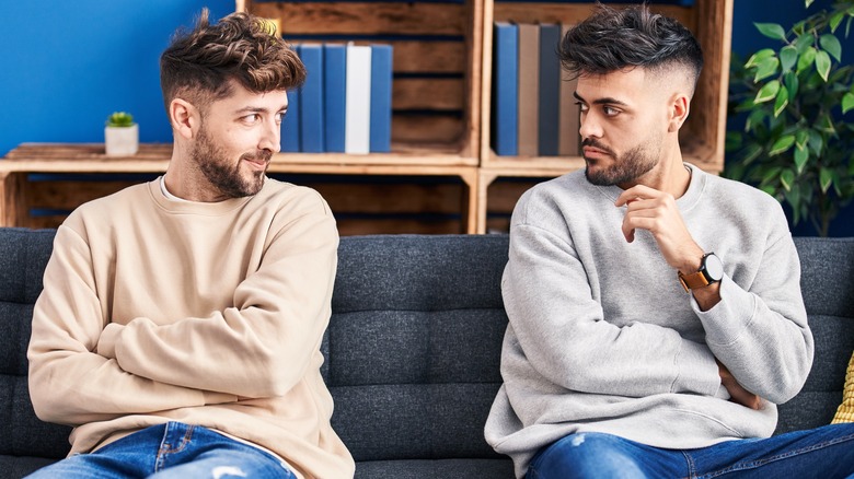 couple disappointed on couch