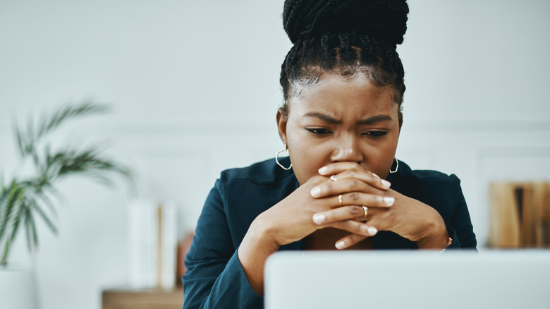 Serious woman on laptop