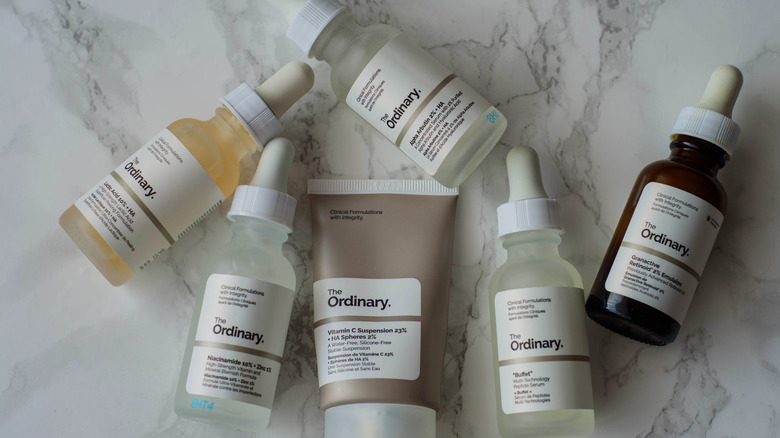 a lineup of skin care products The Ordinary