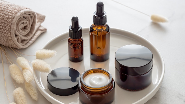 skincare products sitting on top of marble tray