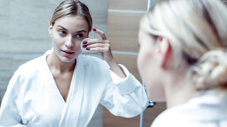 Woman cleaning face before sleep