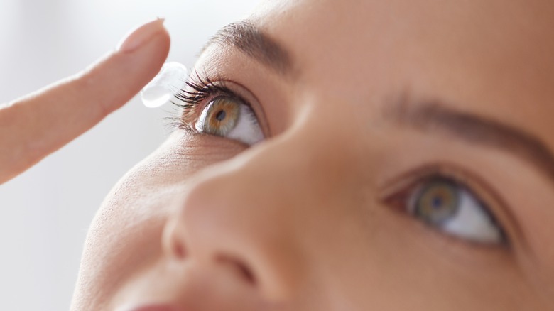 female using contact lenses