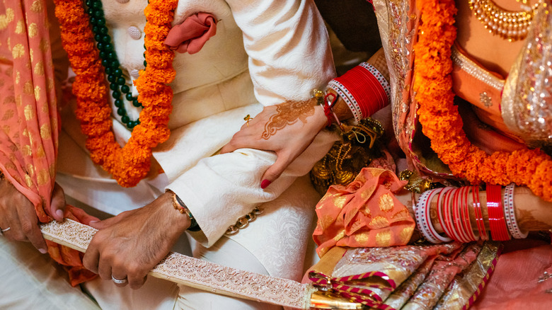 Details of an Indian couple's wedding attire