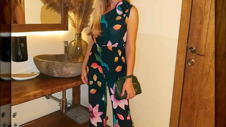 Woman in floral print jumpsuit