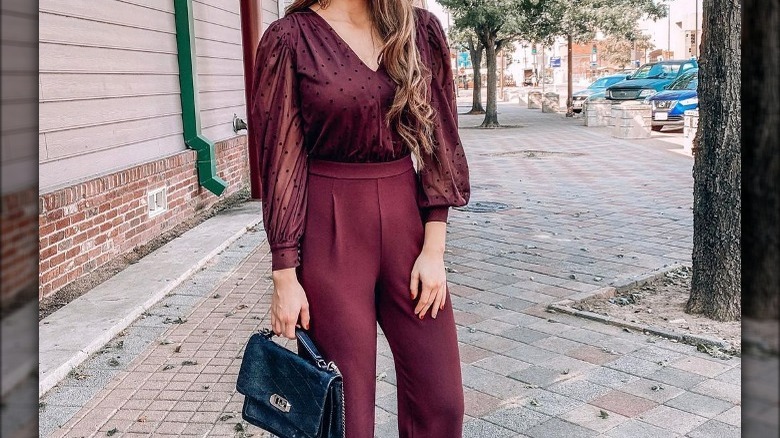 Woman in burgundy shirt and pants