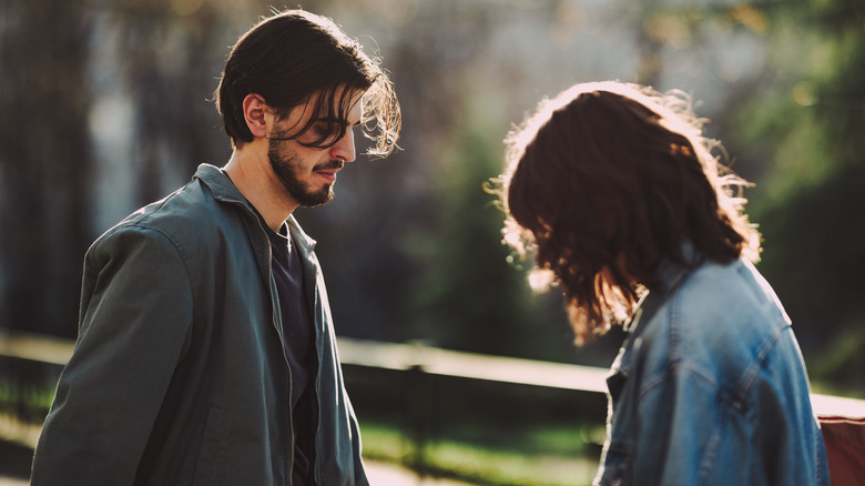 Couple talk outside