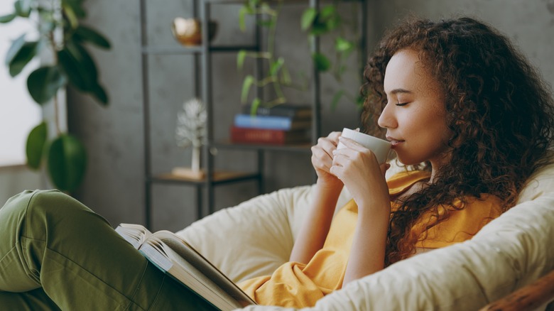 Woman drinking tea at home 