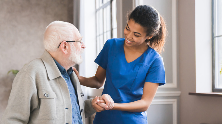 Nurse helping a senior man 