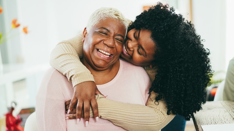 Woman hugging her grandmother 