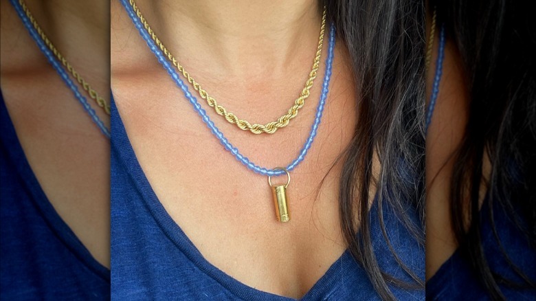 blue beaded necklace and gold chain