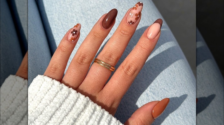 Almond-shaped brown floral nails