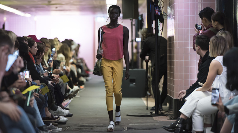 Woman in yellow capri leggings