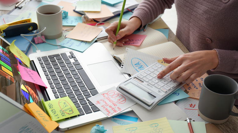 A messy desk illustrating someone working way too hard