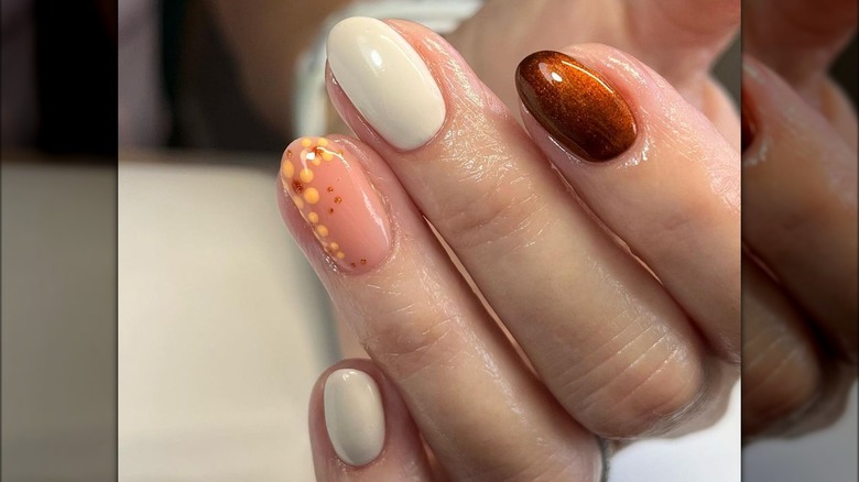 rounded off-white and caramel nails