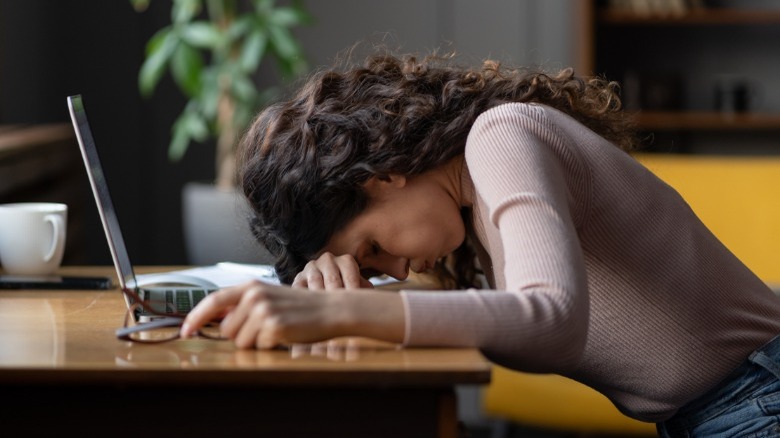 Sad woman lying head down