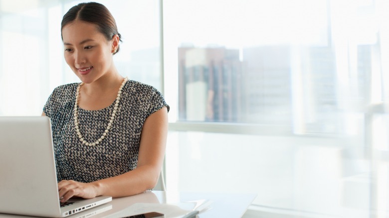 Woman typing on computer