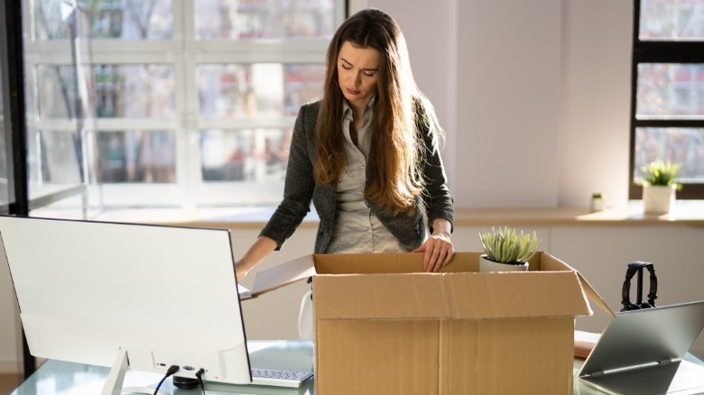 Woman packing up her desk