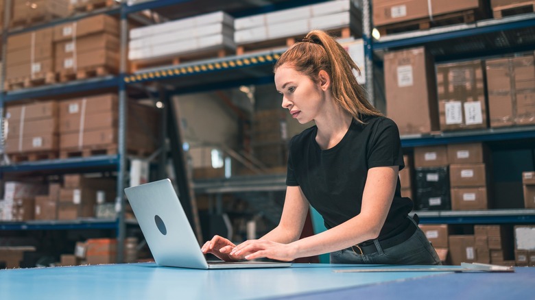 Focused woman working in warehouse