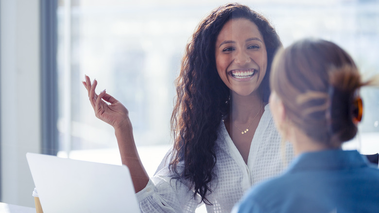 Woman smiling with a work mentor