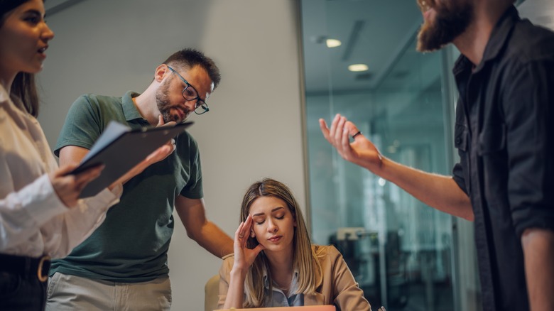 Woman frustrated with co-workers