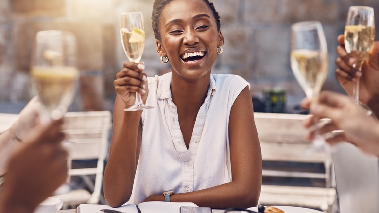 Woman holding champagne glass