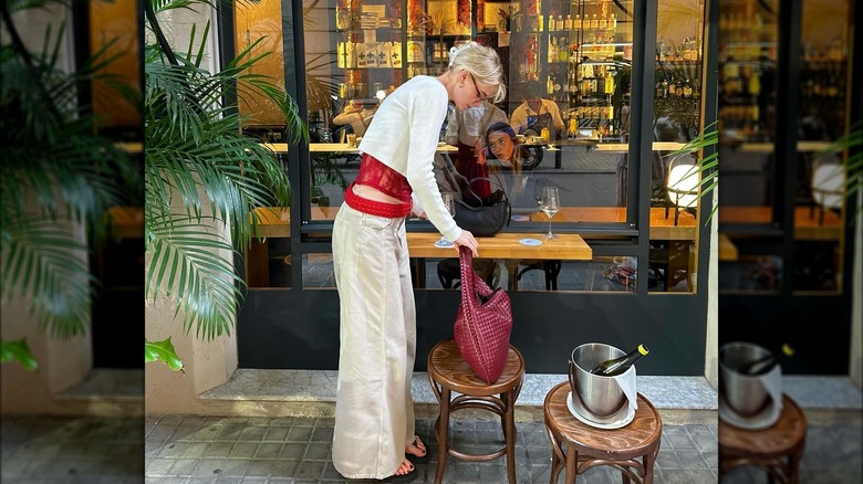 wide-leg cream-colored jeans and cardigan