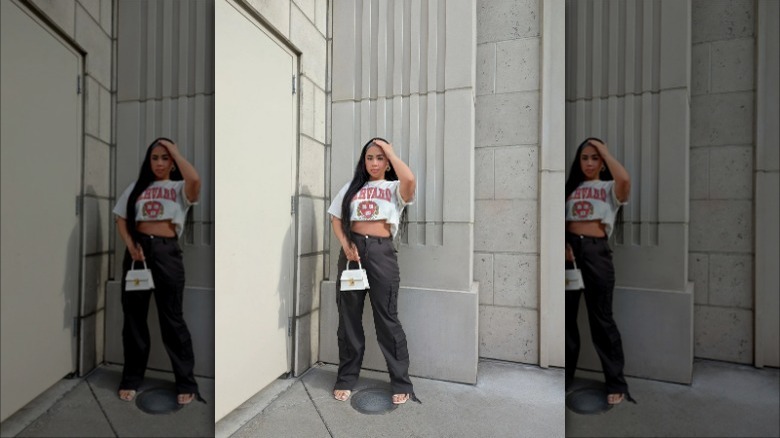 woman wearing crop top and cargo pants