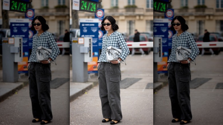 woman wearing cropped jacket and cargo pants