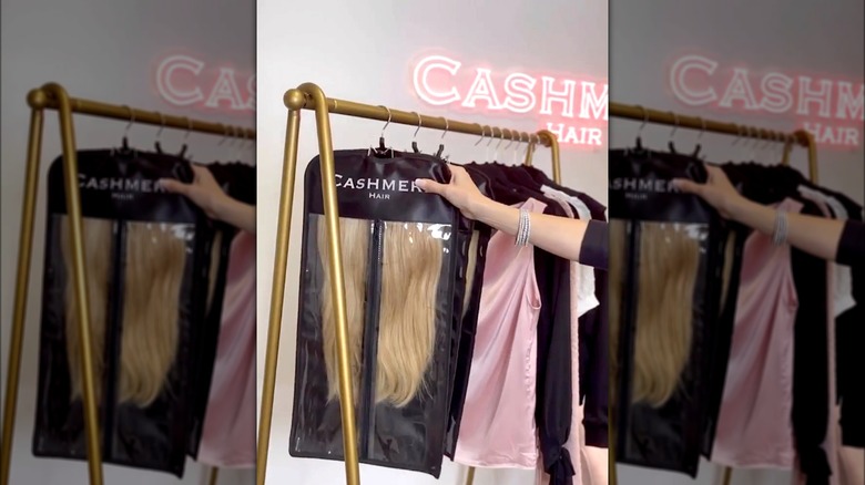 Hand hanging Cashmere Hair extensions on rack