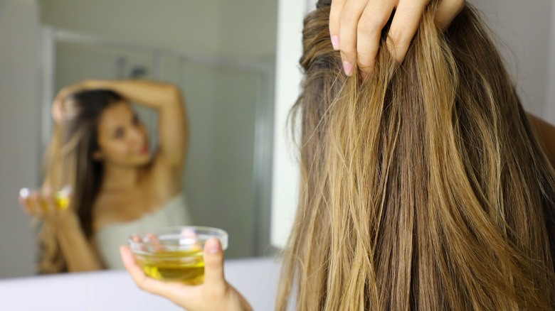 woman with bowl of oil