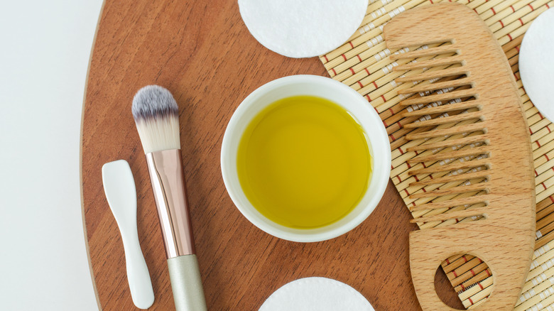 castor oil, comb, and brush