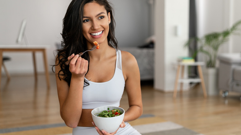 woman eating salad